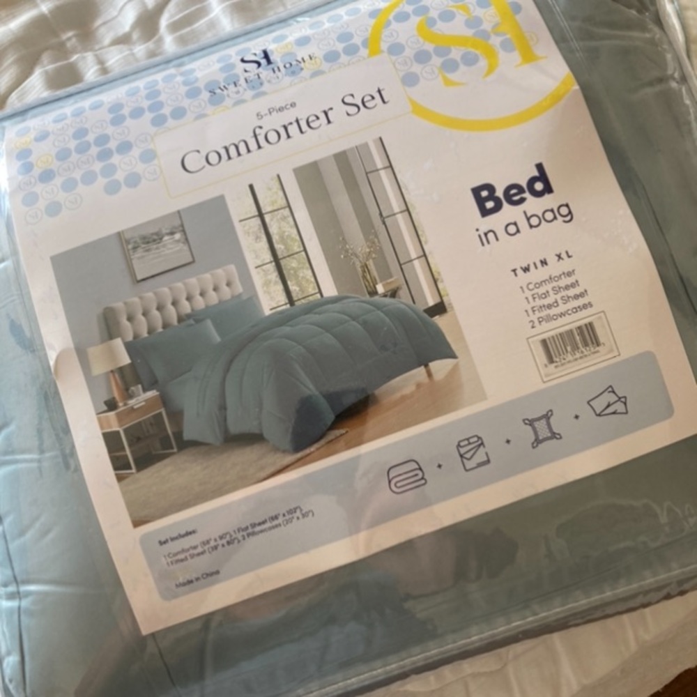 Brand New never open Bed in Bag. XL Twin. More of a color teal blue.